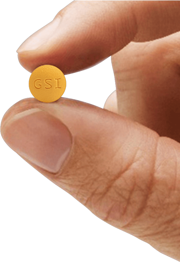 Close-up photo of a hand holding a VEMLIDY pill with GSI engraved on the surface